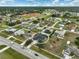 Bird's eye view of a neighborhood displaying well-maintained houses and green lawns at 2114 S Biscayne Dr, North Port, FL 34287