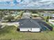 Aerial view of the property showcasing the in-ground pool, landscaped backyard, and neighborhood surroundings at 2114 S Biscayne Dr, North Port, FL 34287