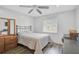 Bedroom features a window and a double-door closet for storage at 2114 S Biscayne Dr, North Port, FL 34287