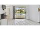 The dining area has tile flooring and sliding glass doors leading to the pool area at 2114 S Biscayne Dr, North Port, FL 34287