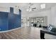 Bright living room with vaulted ceilings, wood floors, and sliding doors to the lanai at 2114 S Biscayne Dr, North Port, FL 34287
