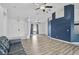 Open living room with vaulted ceilings and wood floors at 2114 S Biscayne Dr, North Port, FL 34287