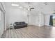 Spacious living room with vaulted ceilings and wood floors at 2114 S Biscayne Dr, North Port, FL 34287