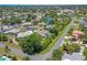 Charming community with lush landscaping, mature trees, and serene pond views at 213 Bayside Ct, Nokomis, FL 34275