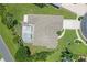 Aerial shot showcasing a home with a screened pool, backyard landscaping, and a well-manicured lawn at 213 Bayside Ct, Nokomis, FL 34275