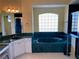 A spacious bathroom featuring a deep tub with a glass block window and dark green counters at 213 Bayside Ct, Nokomis, FL 34275