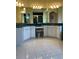 Spacious bathroom featuring a dual sink vanity with white cabinets, a makeup counter, and white tiled floors at 213 Bayside Ct, Nokomis, FL 34275