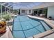 Inviting screened-in pool area featuring a refreshing swimming pool and ample space for outdoor relaxation at 213 Bayside Ct, Nokomis, FL 34275
