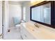 Bathroom featuring neutral flooring, a black framed mirror, white vanity and toilet at 218 Palm Air Dr, Osprey, FL 34229