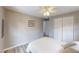 Bedroom featuring wood-look flooring, a closet and neutral colored walls at 218 Palm Air Dr, Osprey, FL 34229