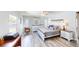Bright bedroom showcasing wood-look flooring, white furniture set and a light blue wall color at 218 Palm Air Dr, Osprey, FL 34229