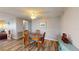 Cozy dining area with a wooden table and four chairs at 218 Palm Air Dr, Osprey, FL 34229