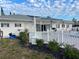 Clubhouse includes pool, plenty of chairs and tables, and beautifully landscaped surroundings at 218 Palm Air Dr, Osprey, FL 34229