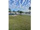 Lovely grounds with table, lawn, and access to activities such as shuffleboard and fitness at 218 Palm Air Dr, Osprey, FL 34229