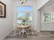 Charming dining area with a round table, wooden chairs, and plenty of natural light at 229 San Marco Dr, Venice, FL 34285