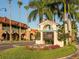 Welcome to Historic Downtown Venice sign surrounded by lush landscaping and charming buildings at 229 San Marco Dr, Venice, FL 34285