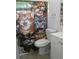 Bathroom features a toilet, sink with vanity, and shower curtain at 231 Redwood Rd, Venice, FL 34293