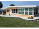 Lovely single-story home, showcasing the lush green lawn and complemented by white rock landscaping at 231 Redwood Rd, Venice, FL 34293