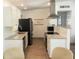 Stylish kitchen with stainless steel appliances, granite countertops, and sleek white cabinetry at 231 Redwood Rd, Venice, FL 34293