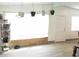 Bright living room with tile floors, stylish decor, and lots of natural light streaming through a large window at 231 Redwood Rd, Venice, FL 34293