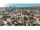 Expansive aerial view of a charming coastal community near the ocean, lined with lush greenery and various building styles at 236 Harbor S Dr # 202, Venice, FL 34285