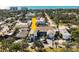 An aerial view of the condo community, nestled in lush greenery near the ocean, offering a tranquil coastal living experience at 236 Harbor S Dr # 202, Venice, FL 34285