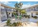 Inviting courtyard with patio seating and lush greenery, offering a relaxing oasis within the condo community at 236 Harbor S Dr # 202, Venice, FL 34285