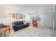 Bright living room featuring a comfortable seating area and a view from the window in this inviting condo unit at 236 Harbor S Dr # 202, Venice, FL 34285