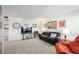 Living area with large TV and comfortable furniture in this welcoming condo unit at 236 Harbor S Dr # 202, Venice, FL 34285