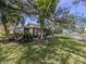 Back exterior view of a home with a screened lanai and a scenic waterfront view at 268 Southampton Dr # 309, Venice, FL 34293
