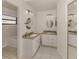 Bright bathroom featuring double sinks, granite countertops, and mirrors offering ample space at 268 Southampton Dr # 309, Venice, FL 34293
