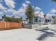Attractive white building surrounded by manicured landscaping and trees, creating a serene atmosphere at 268 Southampton Dr # 309, Venice, FL 34293