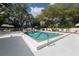 Relaxing community pool featuring lounge chairs and pristine landscaping at 268 Southampton Dr # 309, Venice, FL 34293