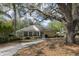 Charming single-story home with lush landscaping and a welcoming walkway at 268 Southampton Dr # 309, Venice, FL 34293