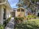 Inviting front entrance with landscaped garden beds and a charming walkway to the front door at 268 Southampton Dr # 309, Venice, FL 34293