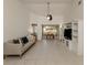 Bright living room with neutral decor, tile flooring, and a view of the backyard through the dining area at 268 Southampton Dr # 309, Venice, FL 34293