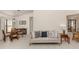 Inviting living room featuring neutral decor, tile floors, and an open layout to the dining area at 268 Southampton Dr # 309, Venice, FL 34293