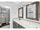 Tastefully updated bathroom features modern fixtures, granite countertops, and a glass block shower at 275 Mission W Trl # G, Venice, FL 34285