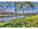 Scenic lake view surrounded by lush landscaping in this condo community, offering tranquility and natural beauty at 275 Mission W Trl # G, Venice, FL 34285