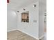 The dining room showcases modern track lighting and a pass-through window to the kitchen at 275 Mission W Trl # G, Venice, FL 34285