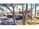 A community featuring mature trees, covered parking, and well-maintained landscaping for comfortable living at 275 Mission W Trl # G, Venice, FL 34285