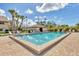 Community pool with a clean, inviting water, lounge chairs, and well-maintained landscaping at 275 Mission W Trl # G, Venice, FL 34285
