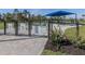 Fenced dog park featuring separate areas for large and small dogs with seating under a shaded structure at 29176 Coral Harbour Dr, Englewood, FL 34223