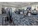 Community gym with modern exercise equipment, including treadmills and weight machines, and bright natural light at 29176 Coral Harbour Dr, Englewood, FL 34223