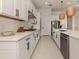 Elegant white kitchen featuring modern appliances, sleek countertops, and ample storage at 29176 Coral Harbour Dr, Englewood, FL 34223