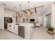 Open kitchen layout with a center island, stainless steel appliances, and ample counter space at 29176 Coral Harbour Dr, Englewood, FL 34223