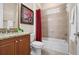 Well-appointed bathroom with a tub/shower combo and a vanity with granite countertop at 297 Martellago Dr, North Venice, FL 34275