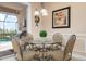 Cozy breakfast nook with views of the pool area and outdoor grill at 297 Martellago Dr, North Venice, FL 34275