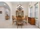 Bright dining room with tile floors, chandelier, and wood furniture at 297 Martellago Dr, North Venice, FL 34275