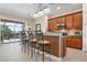 Kitchen with granite counters, stainless appliances, tile backsplash and breakfast bar at 297 Martellago Dr, North Venice, FL 34275